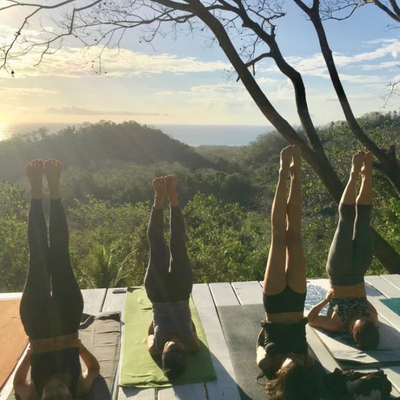 Open-air yoga practice surrounded by jungle at The Sanctuary at Two Rivers Costa Rica